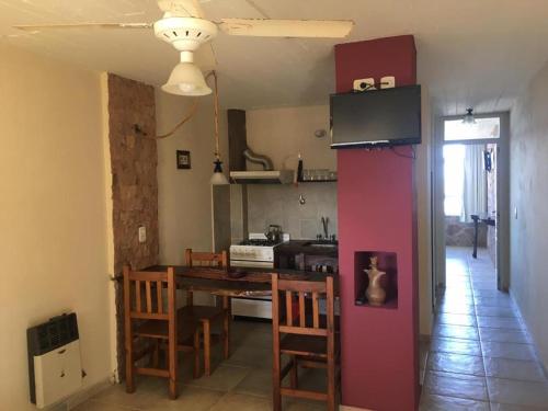 a kitchen and dining room with a table and a dining room gmaxwell gmaxwell gmaxwell gmaxwell at Adeliz Playa in Santa Teresita