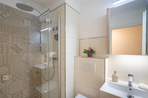 a bathroom with a shower and a sink at Oberstdorfer Bergwelt 246 in Oberstdorf