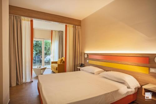 Postel nebo postele na pokoji v ubytování Tonicello Hotel Resort & SPA