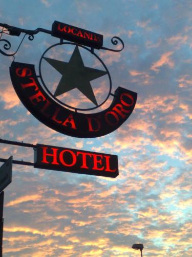 a sign for a hotel with a star on it at Locanda Stella D'oro in Quinto di Treviso