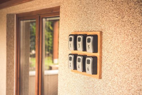 a group of dominoes on the side of a wall at Vila Anna - Ubytovanie Bešeňová in Bešeňová