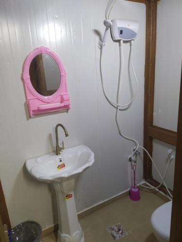 a bathroom with a sink and a mirror at Success Hostel in Nablus