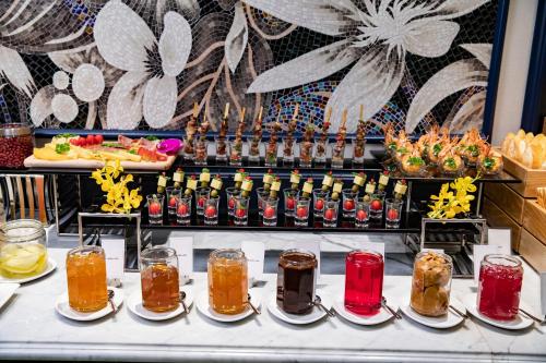 a buffet with many different types of food and drinks at Soleil Boutique Hotel Hanoi in Hanoi