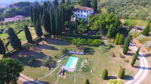 an aerial view of a estate with a swimming pool and trees at Villa al Borghetto in Uzzano