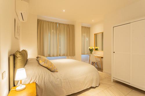 a bedroom with a bed and a desk in it at Your Private Harbour on Lake Como by Rent All Como in Laglio