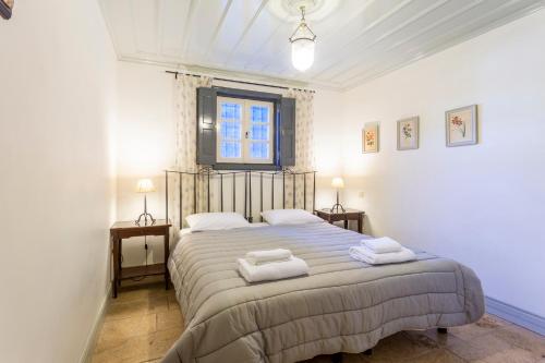 En eller flere senge i et værelse på Villa Scirocco