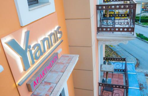 a view of a building with a swimming pool at Yiannis Apartments in Ioannina