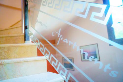 a set of stairs leading up to a building at Yiannis Apartments in Ioannina