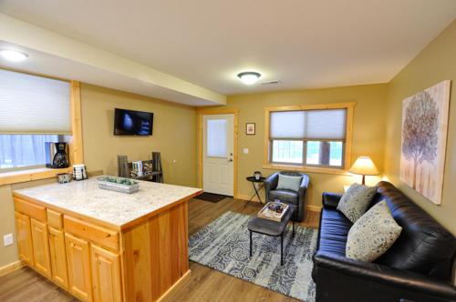 a living room with a couch and a counter top at Paddle Ridge in West Glacier