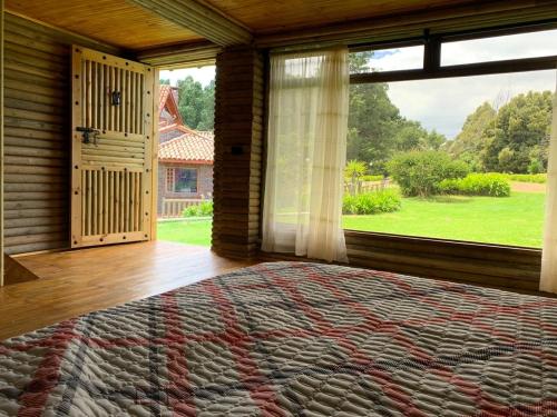 Una cama o camas en una habitación de Hacienda la Odisea