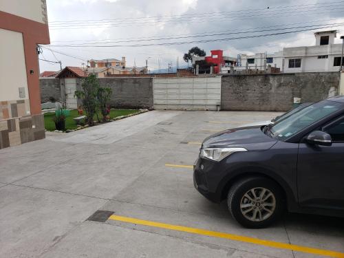 a car parked in a parking lot at Hospedaje San Fernando in Cayambe
