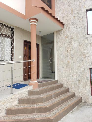 a set of stairs in front of a house at Hospedaje San Fernando in Cayambe