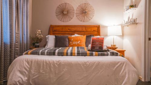 a bedroom with a bed with a book on it at Playpark Lodge in South Lake Tahoe