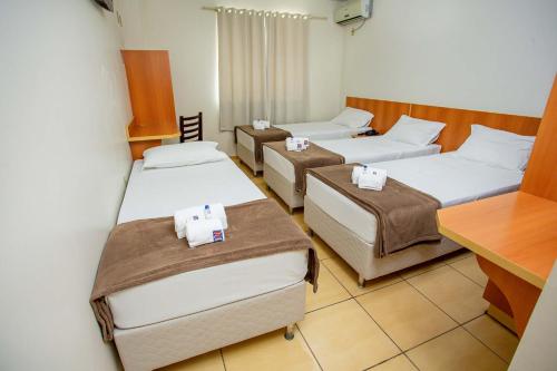 Hotel Zandoná tesisinde bir odada yatak veya yataklar