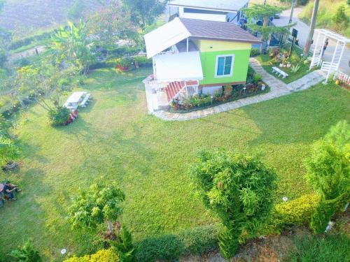 an aerial view of a house with a yard at บ้านปลายฝัน Baanplaifun in Ban Huai Phai