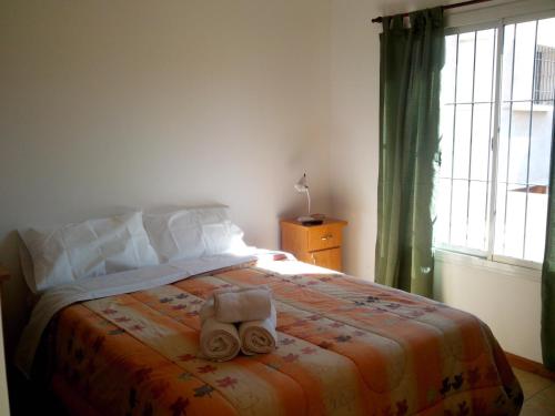Posteľ alebo postele v izbe v ubytovaní Complejo Granaderos