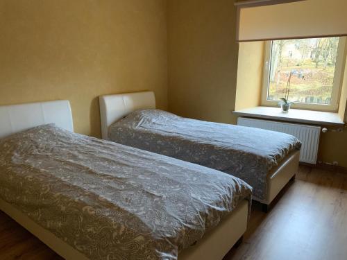 Cama o camas de una habitación en Nooruse puhkemaja
