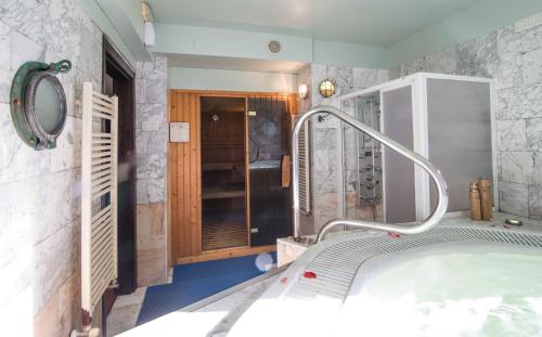 a bathroom with a bath tub in a room at Hotel SPA Atxaspi in Lesaka