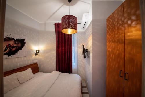 Ένα ή περισσότερα κρεβάτια σε δωμάτιο στο Heights Accommodation City Center