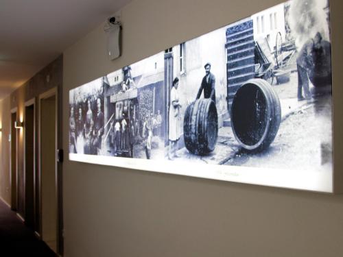 a large picture on a wall in a room at Brauerei_Gasthof Pfister in Eggolsheim