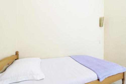 Ένα ή περισσότερα κρεβάτια σε δωμάτιο στο Krisna Hostel