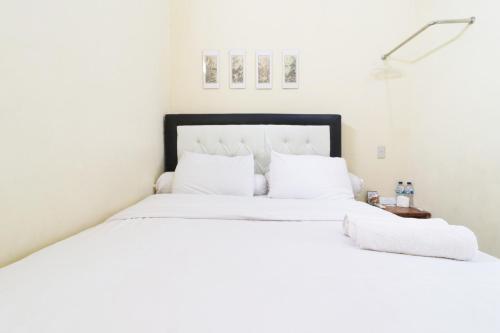 Ένα ή περισσότερα κρεβάτια σε δωμάτιο στο Krisna Hostel