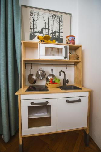 a small kitchen with a sink and a microwave at Old Chestnut Vacation Home in Varaždinske Toplice