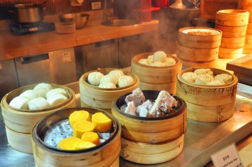 a bunch of canisters filled with food on a counter at Radisson Blu Hotel Liuzhou in Liuzhou