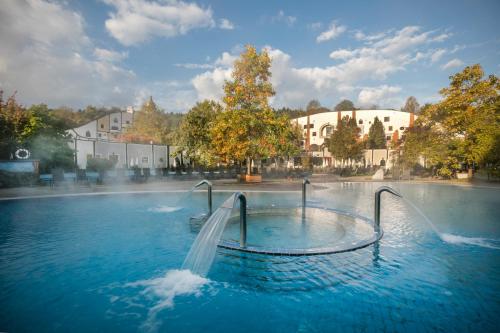 a water park with a water slide in the middle at Rogner Bad Blumau in Bad Blumau