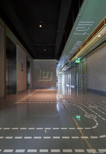 a hallway of a building with a tile floor at Samsen Street Hotel in Bangkok