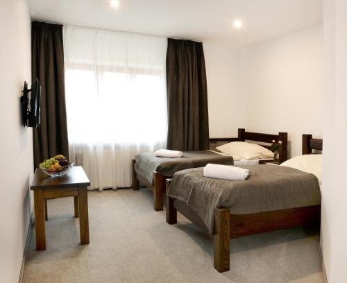 Katil atau katil-katil dalam bilik di Restaurace a penzion pod hradem