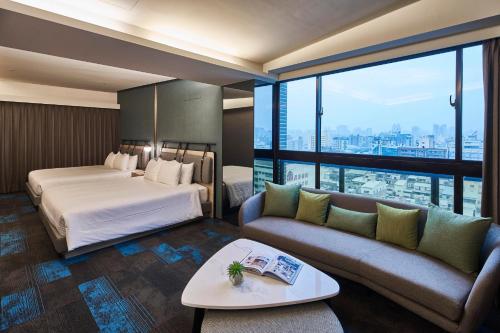 Postel nebo postele na pokoji v ubytování Kung Shang Design Hotel