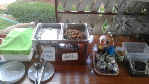 a table with a tray of food on top of it at The Memory of Khaokho in Phetchabun