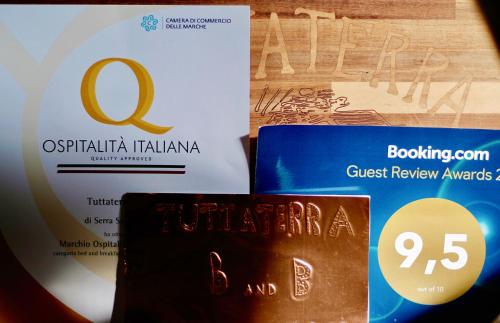 two books sitting next to each other on a table at Tuttaterra in Serra San Quirico