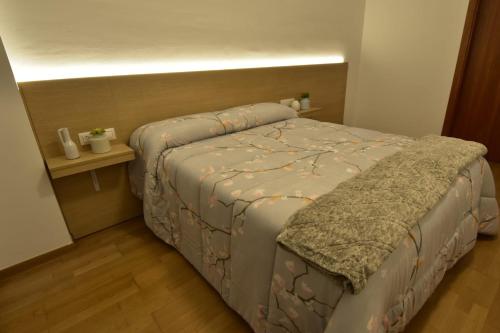 Posteľ alebo postele v izbe v ubytovaní Apartament Gredera