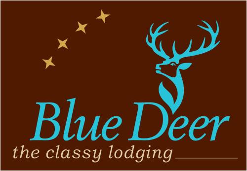 a blue deer logo with stars on a brown background at BLUE DEER in Umag