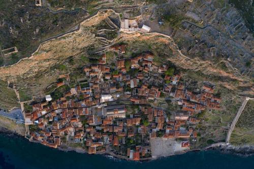 an island with houses on top of a mountain at Victoria's House in Monemvasia Castle in Monemvasia