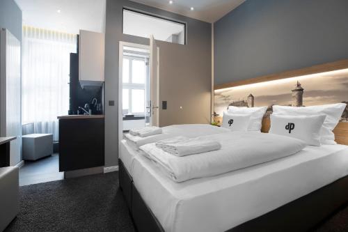 Aparthotel by dasPaulにあるベッド