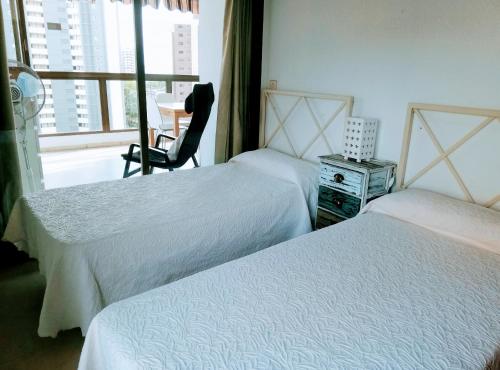 A bed or beds in a room at GEMELOS 2 BIG VIEWS