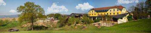 a large yellow house on top of a hill at Kerndlerhof in Ybbs an der Donau