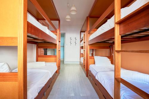 a row of bunk beds in a dorm room at Ey Lisbon GuestHouse in Lisbon