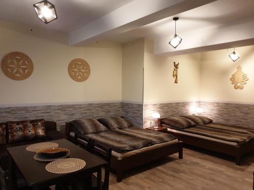 a living room with a couch and a table at Willa Baca in Duszniki Zdrój
