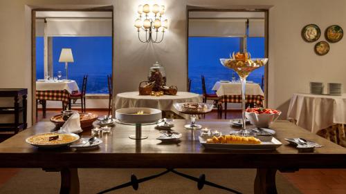 a table with food on it in a dining room at Pousada de Marvao in Marvão