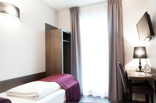 Katil atau katil-katil dalam bilik di Hotel Isabella