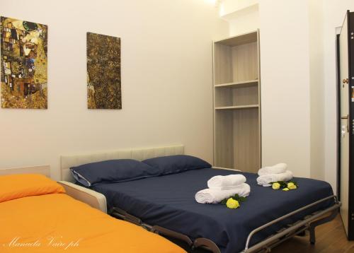 Ένα ή περισσότερα κρεβάτια σε δωμάτιο στο SEAFRONT APARTMENT SALERNO