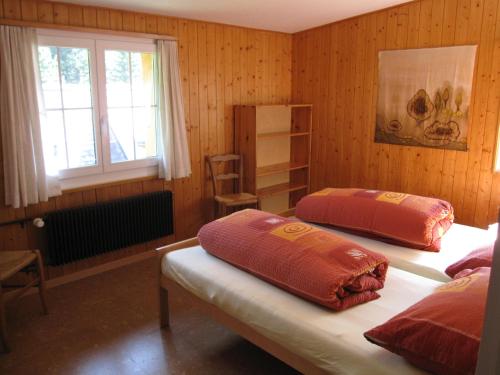 A bed or beds in a room at Ferienhaus Ahorn