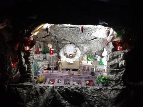 a model of a cave with a shrine in it at Royal Guest House in Nazareth