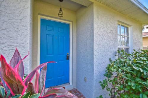 a blue door on a house with a plant at Ybor Casita! 3-Bedrooms Steps away from Centro Ybor! in Tampa