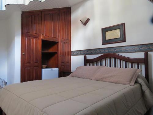 Кровать или кровати в номере Hotel Colonial