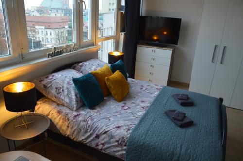 A bed or beds in a room at Good morning in Szczecin